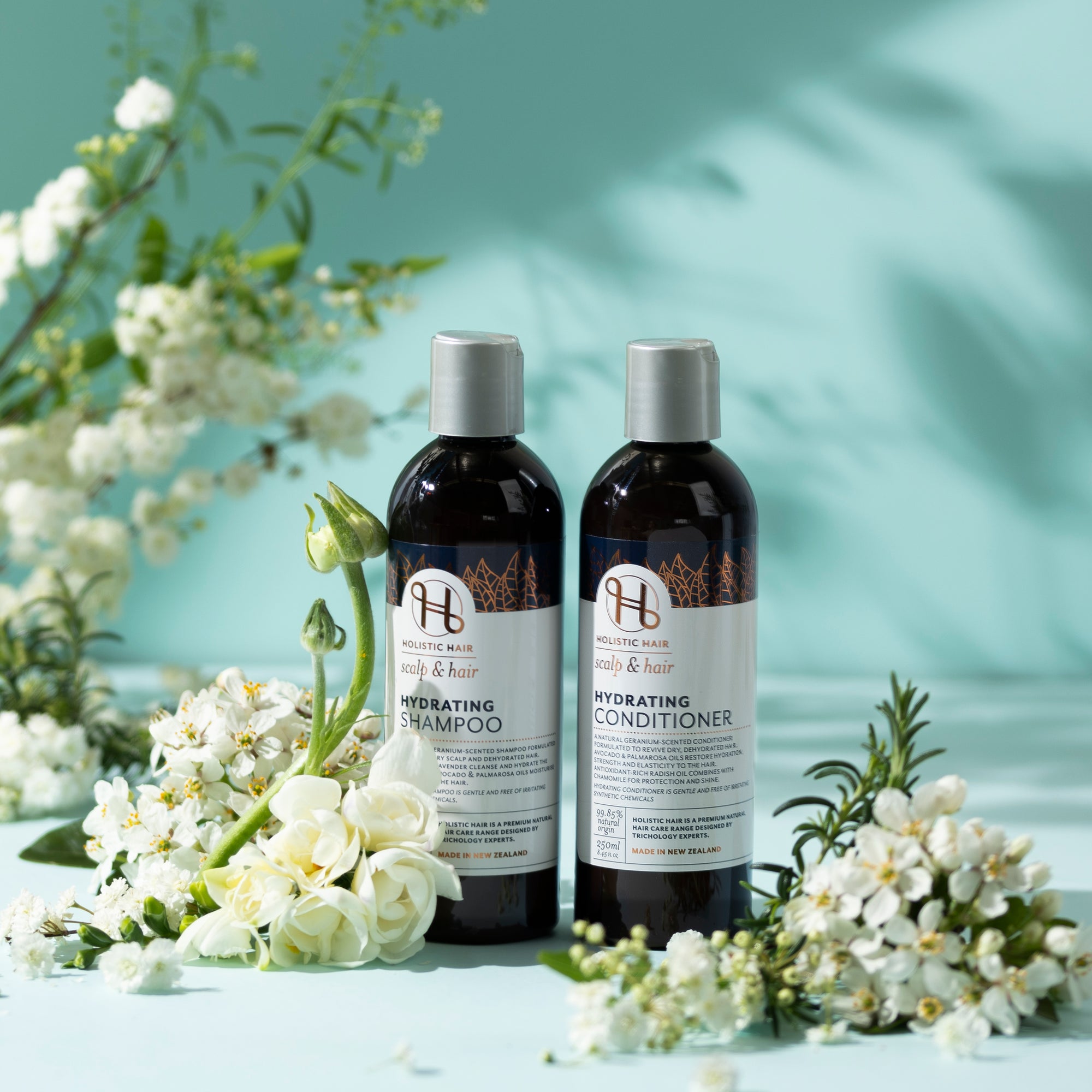 Plant-based hair care duo featuring Avocado, Palmarosa, and Chamomile for moisture and shine.