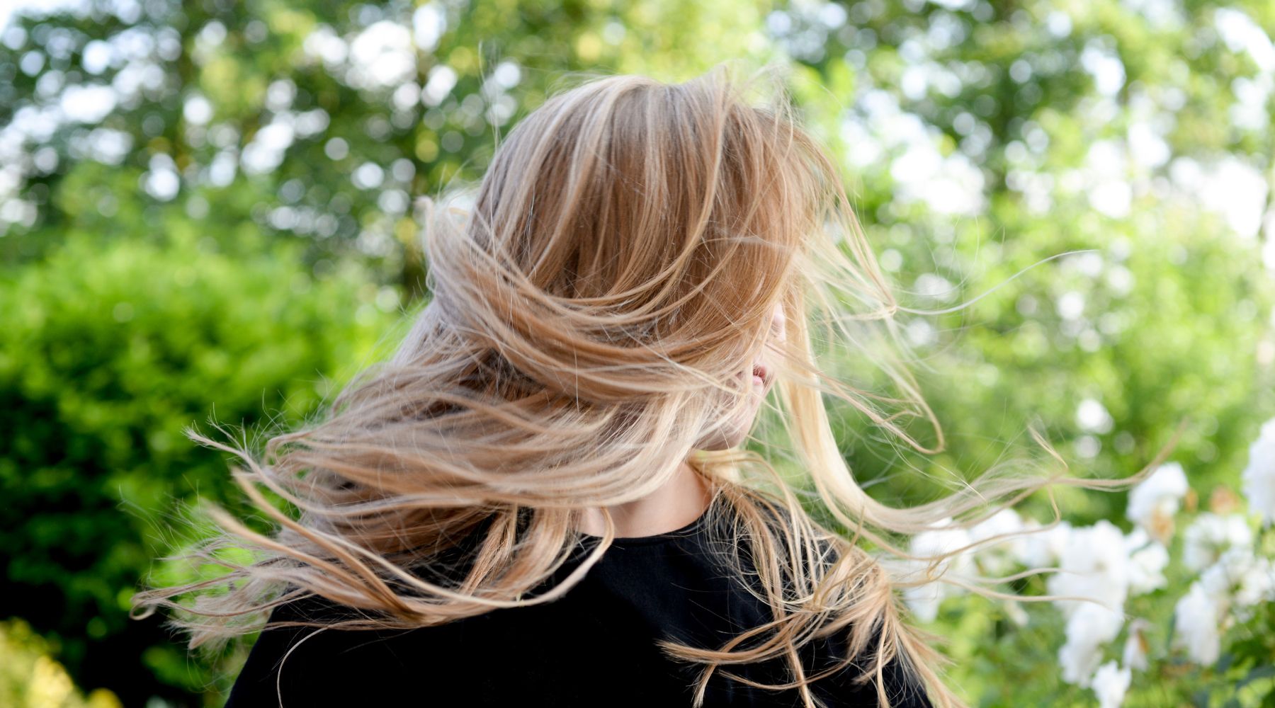 Women with beautiful healthy hair after using Holistic Hair products.